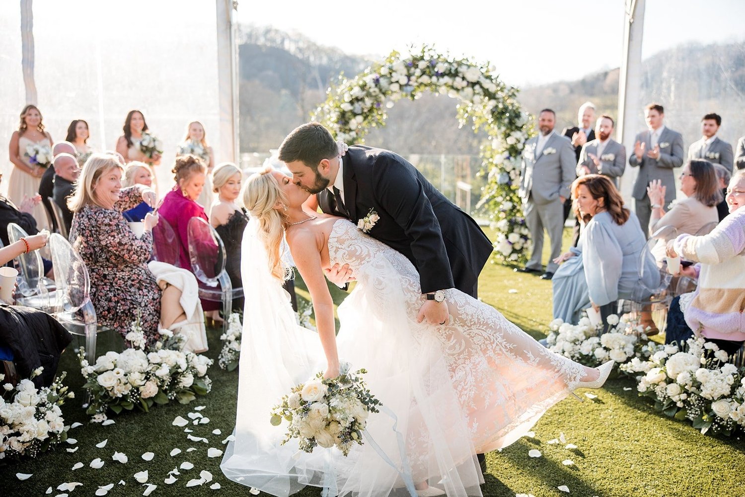 Bride and groom portrait with wedding florals